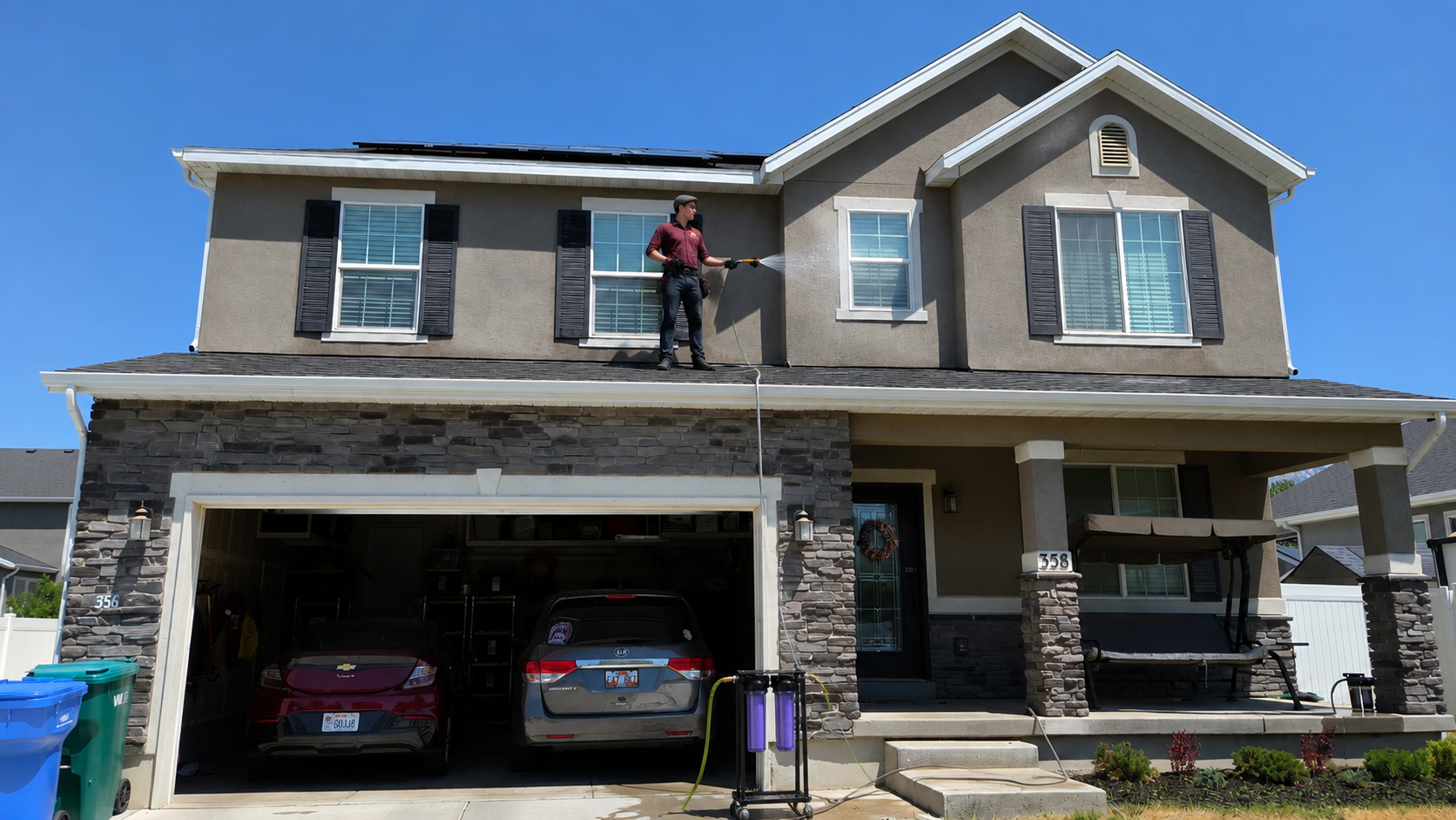 Jac working on a rooftop overlooking a Utah County neighborhood