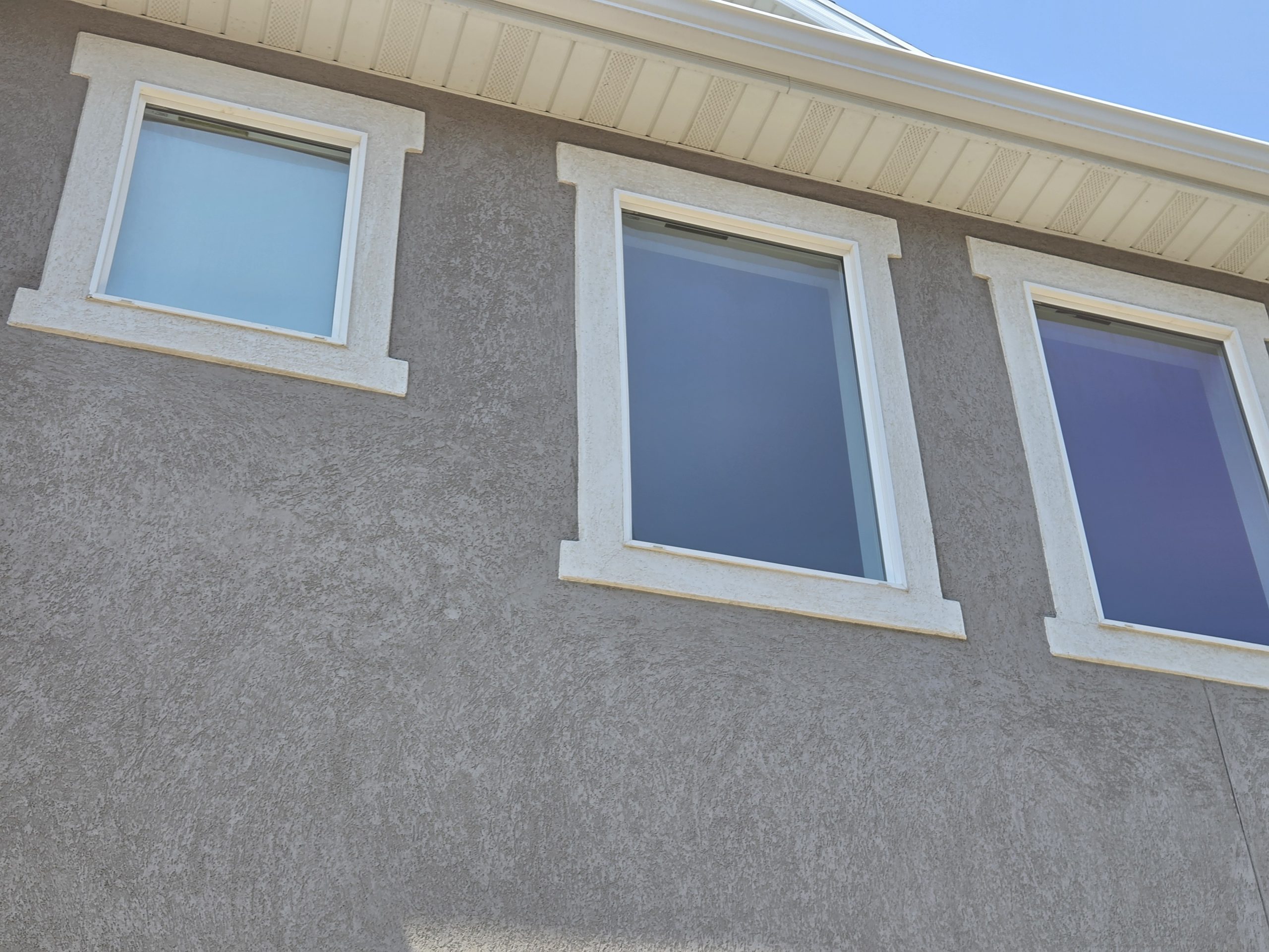 Clean windows along the upper story