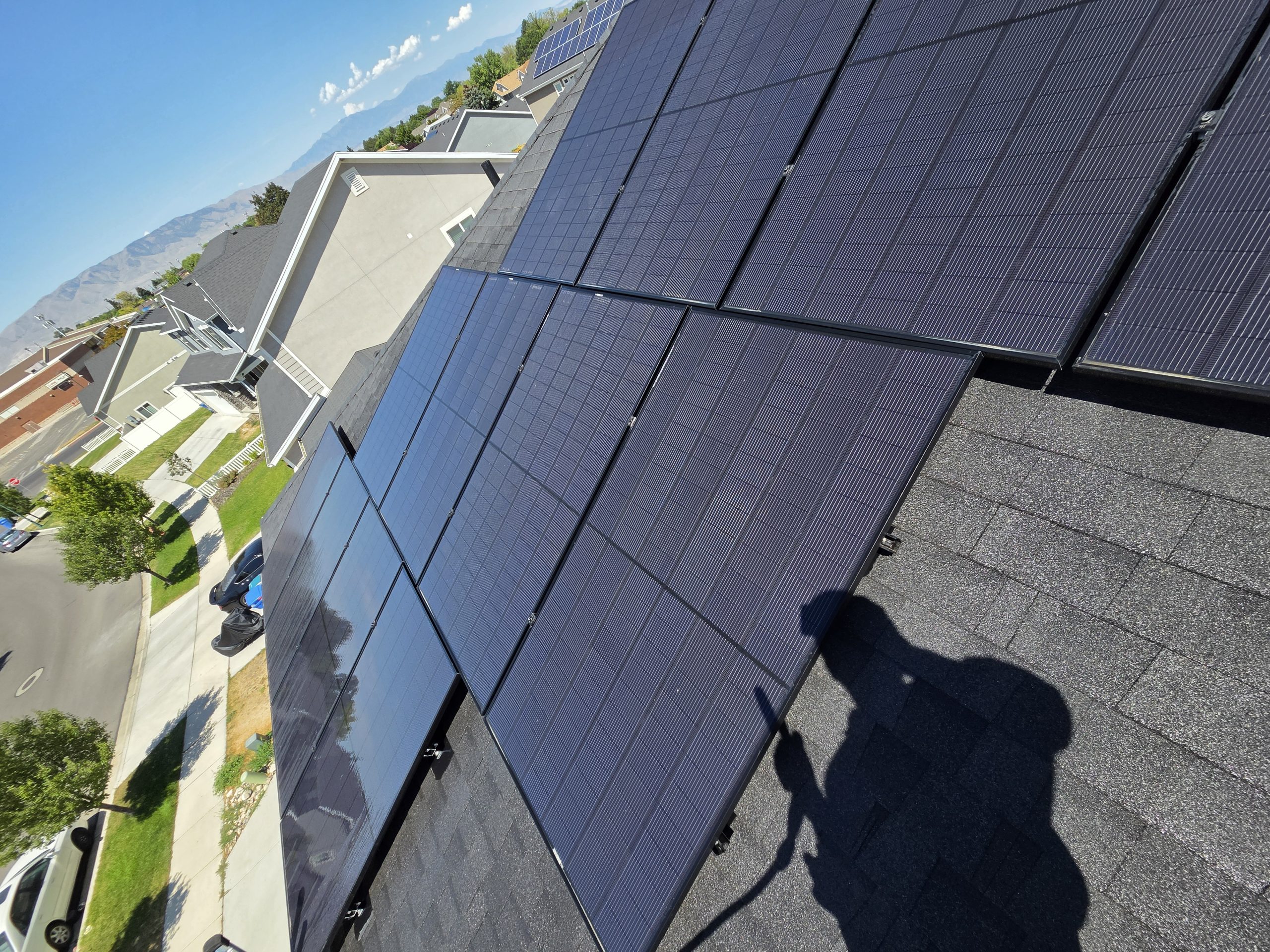 Working on the solar panels with the street and mountains below