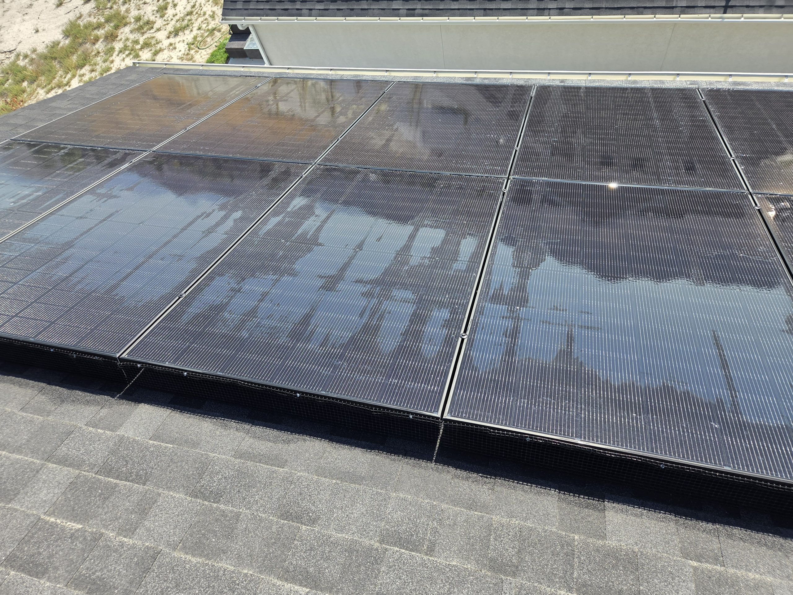 Solar panels freshly rinsed, water still beaded on the surface